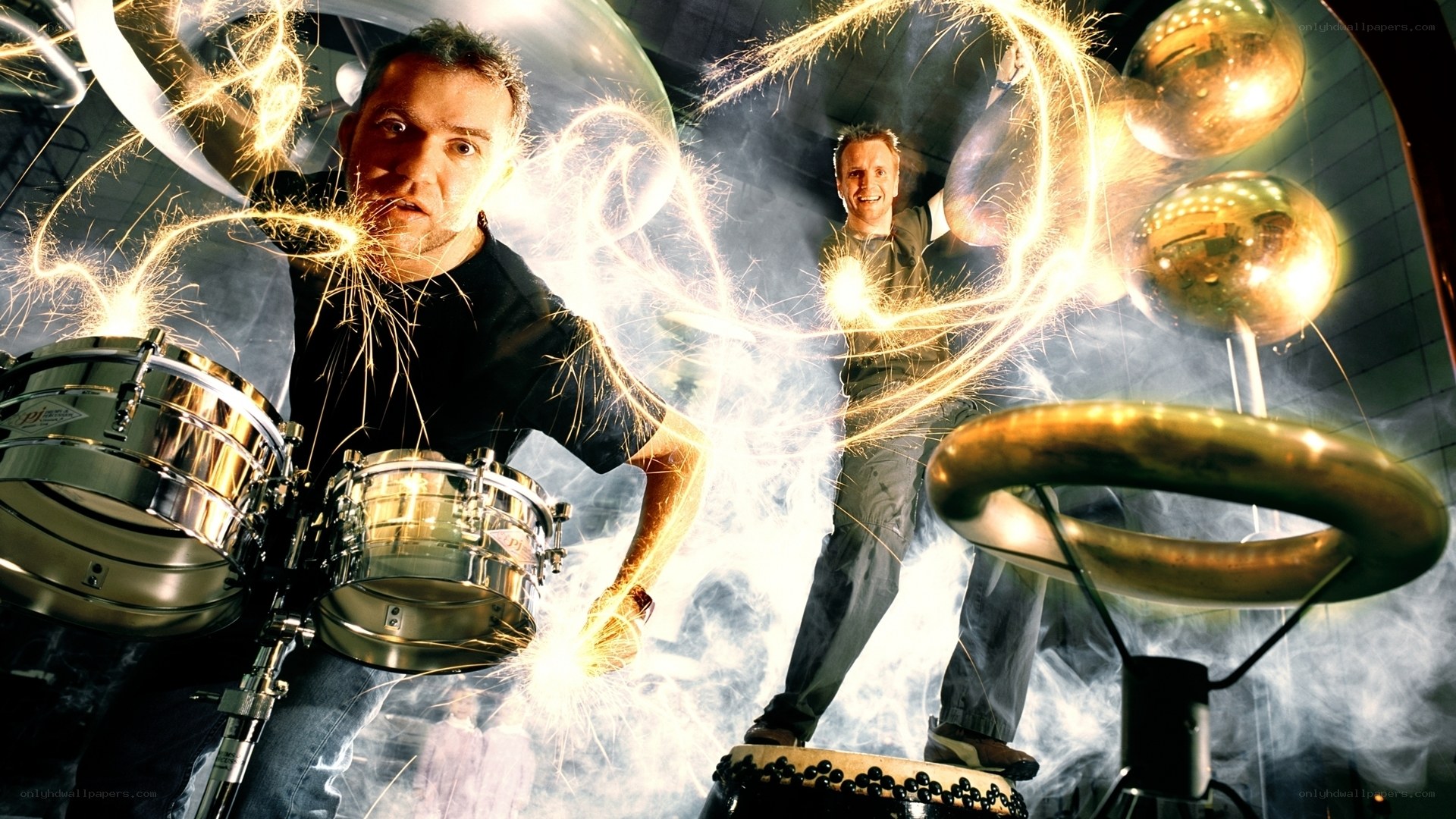 Men with sparklers and drums