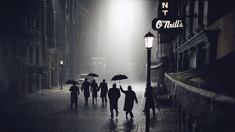 Men with Umbrellas in Rain