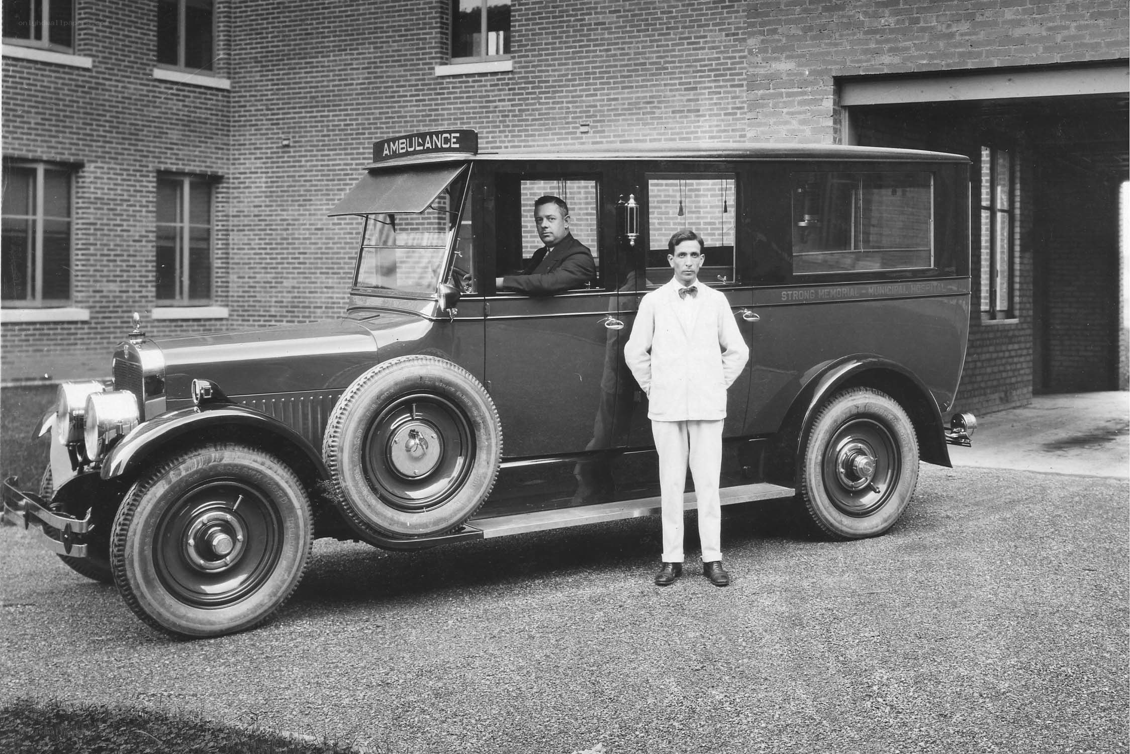 Men with vintage ambulance