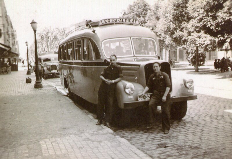 Men with vintage bus in city