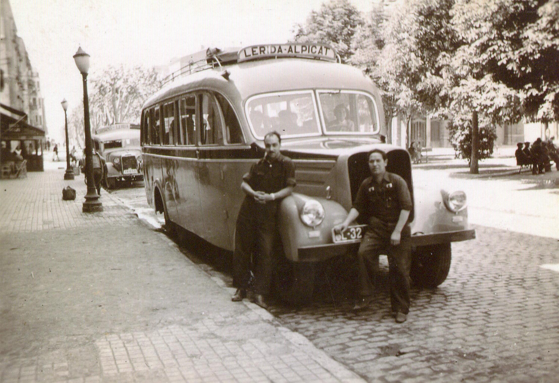 Men with vintage bus in city