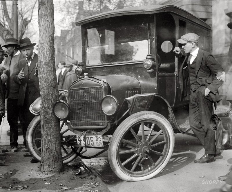 Men with vintage car in city