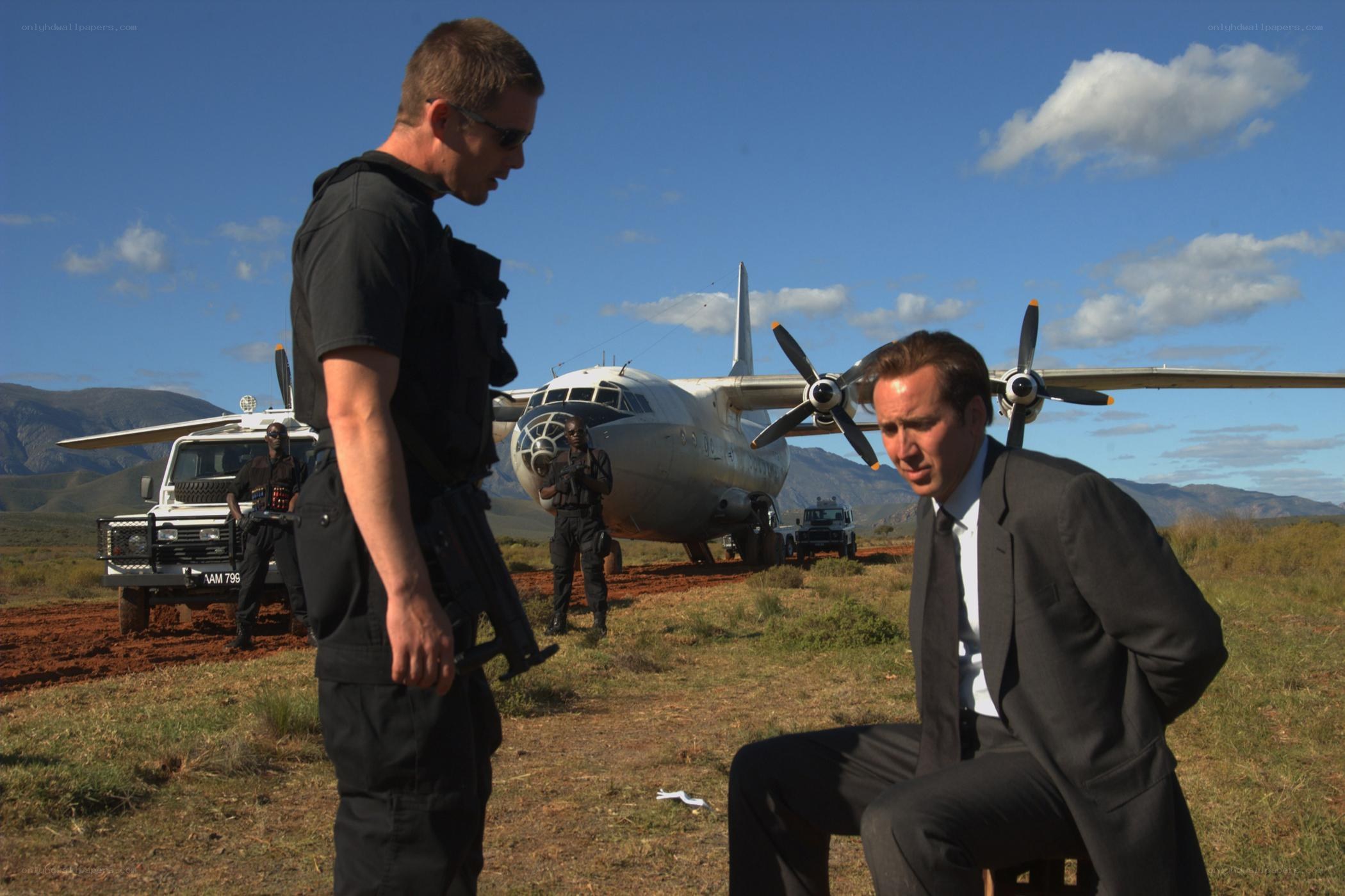 Men with weapons near airplane