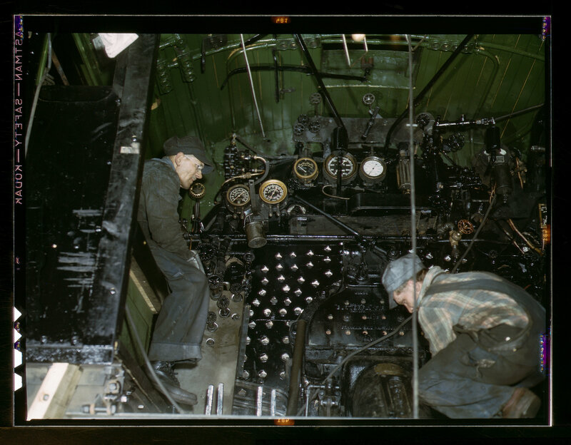 Men working on a steam engine