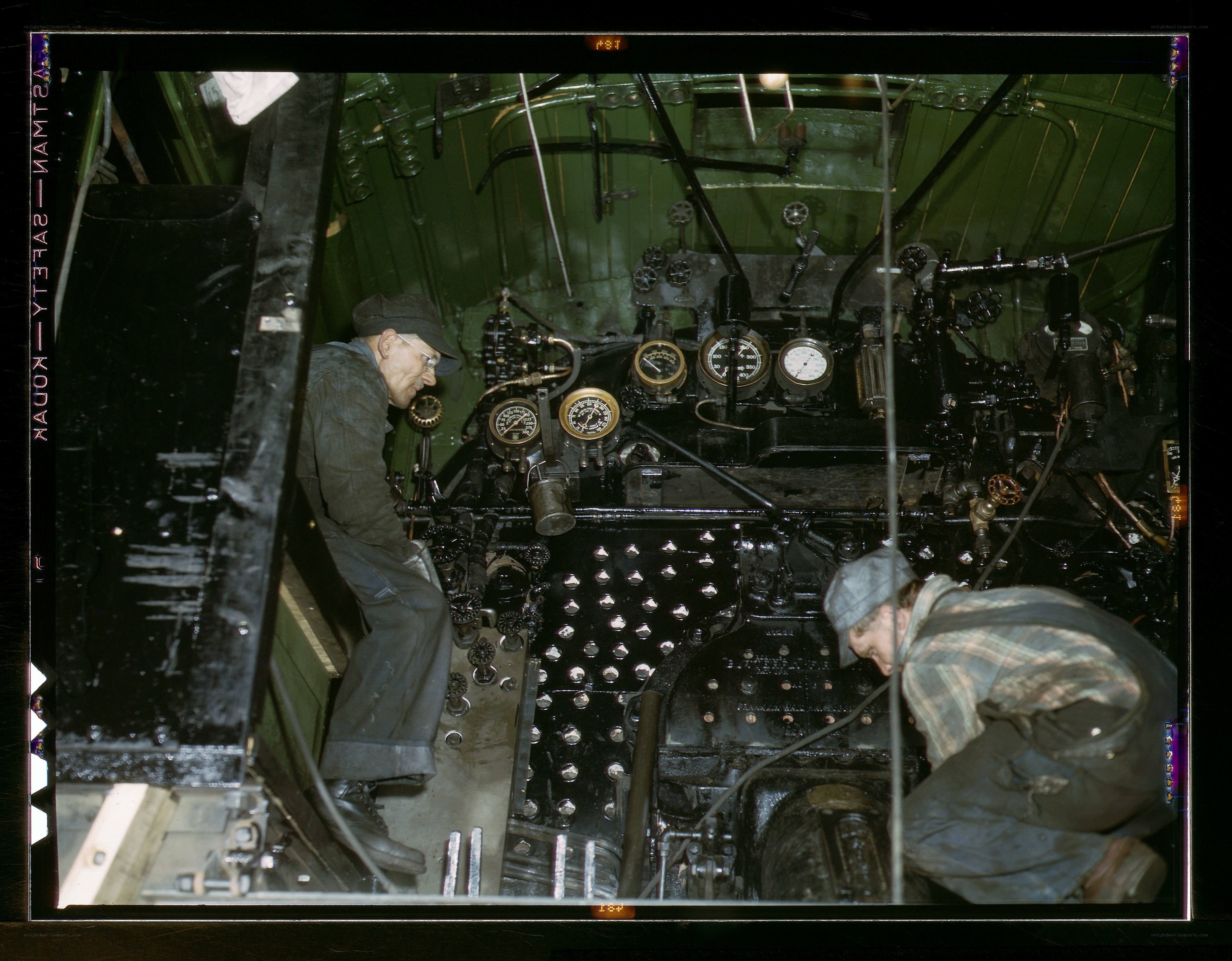 Men working on a steam engine