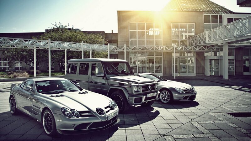 Mercedes-Benz cars in front of building