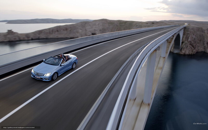 Mercedes-Benz convertible on a coastal bridge
