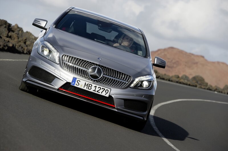 Mercedes-Benz driving on a road