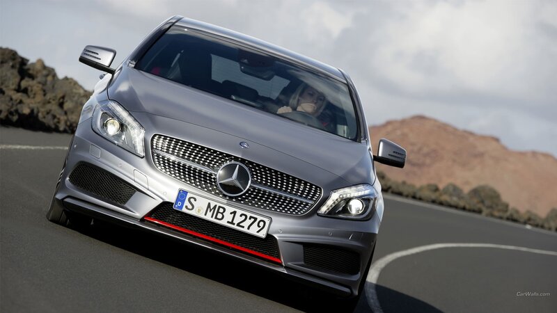 Mercedes-Benz driving on road