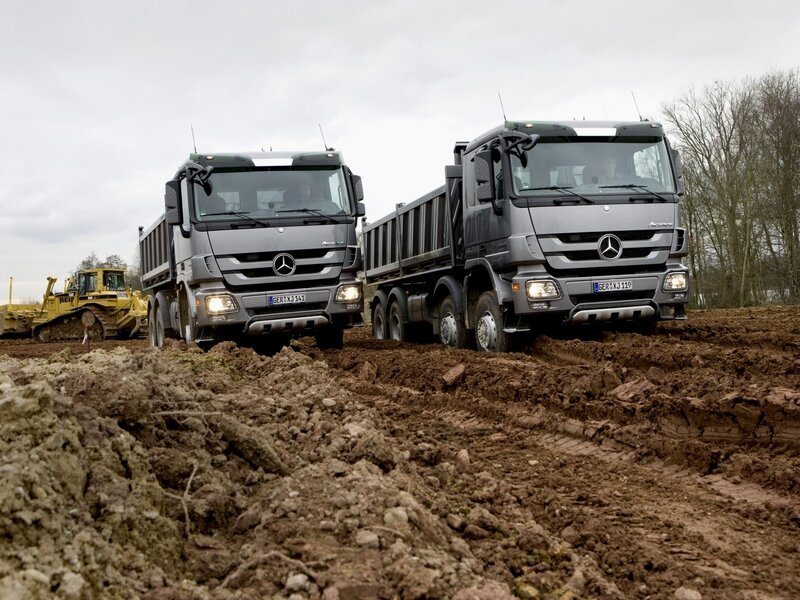 Mercedes-Benz dump trucks on construction site