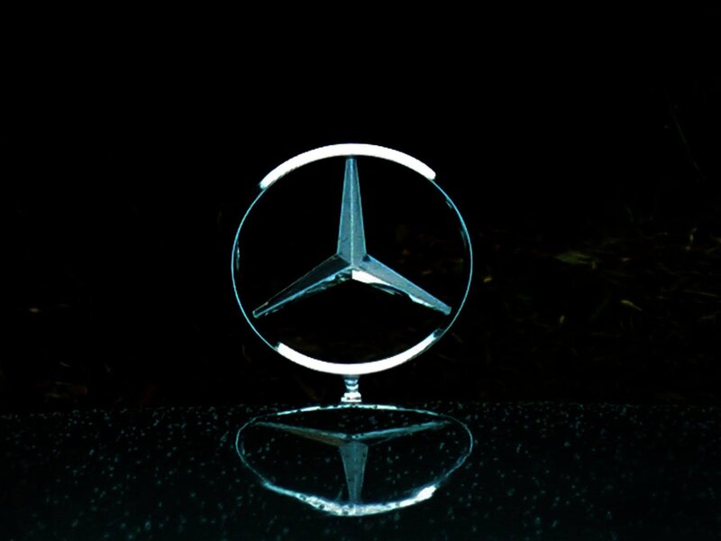 Mercedes-Benz logo on wet surface