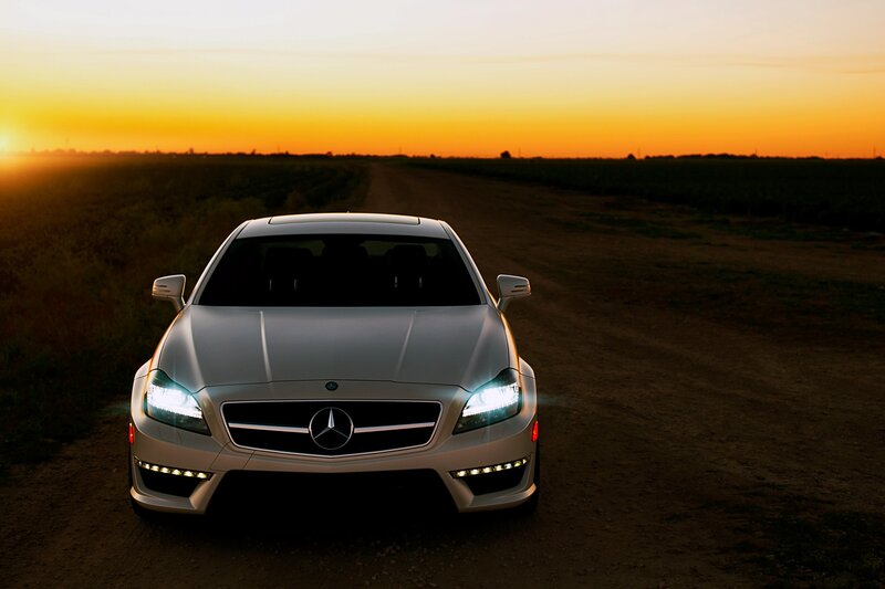 Mercedes-Benz on a dirt road at sunset