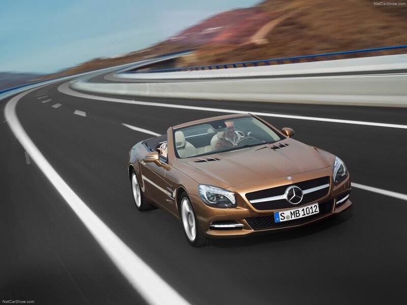 Mercedes-Benz SLK driving on a road