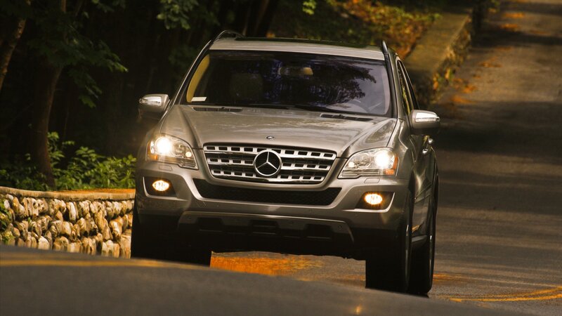 Mercedes-Benz SUV on a forest road