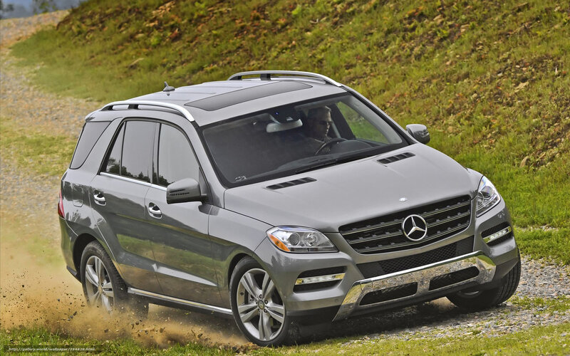Mercedes-Benz SUV on gravel road