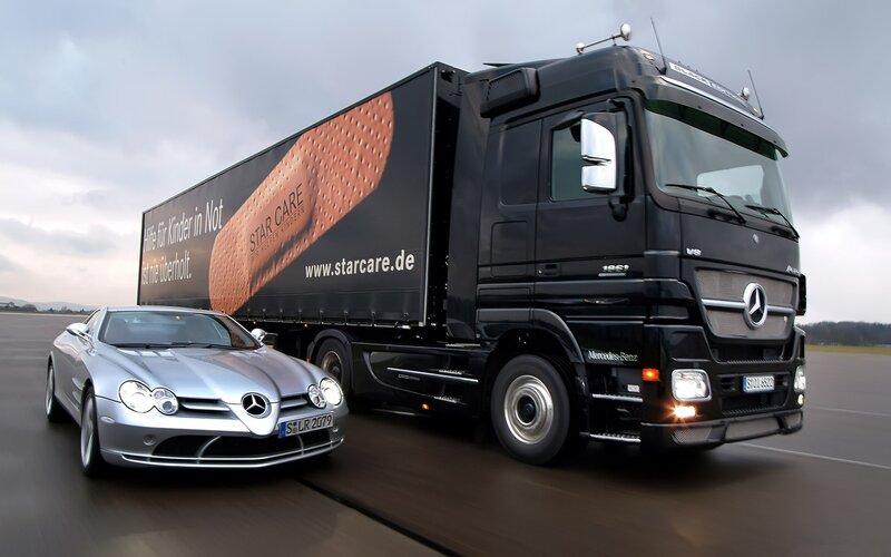 Mercedes-Benz truck and car on track