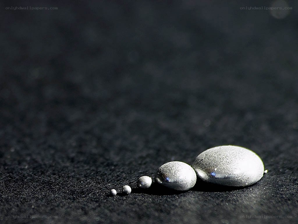 Mercury droplets on dark surface