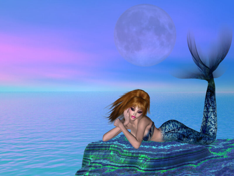 mermaid on a rock at night