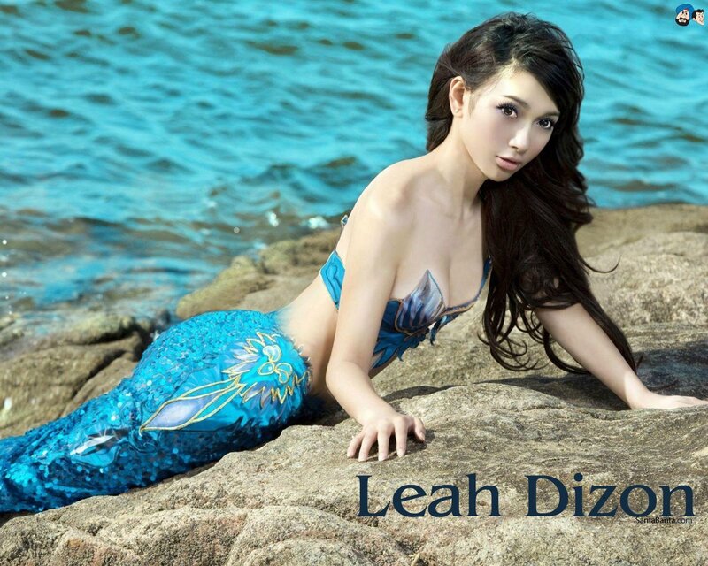Mermaid on rocky shore