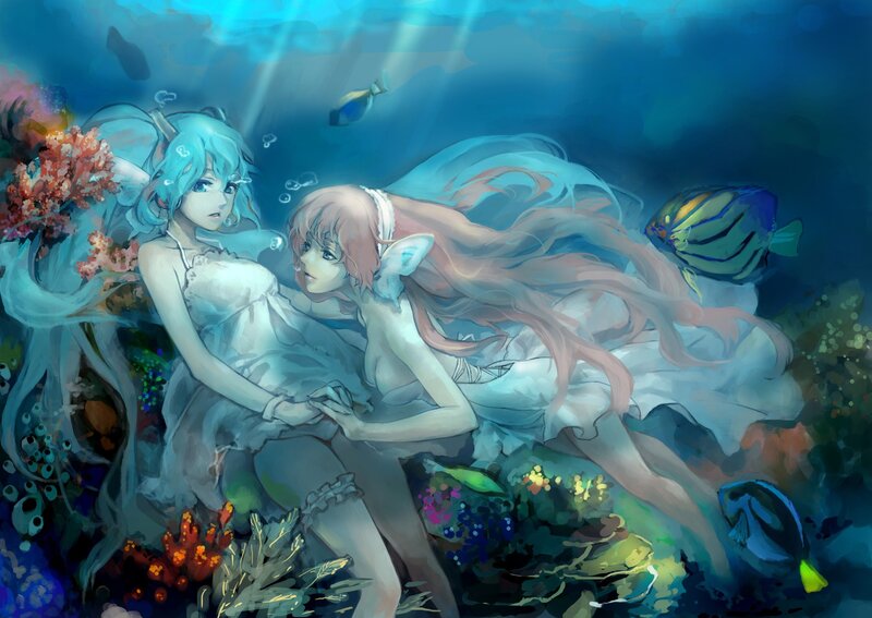 mermaids in underwater garden