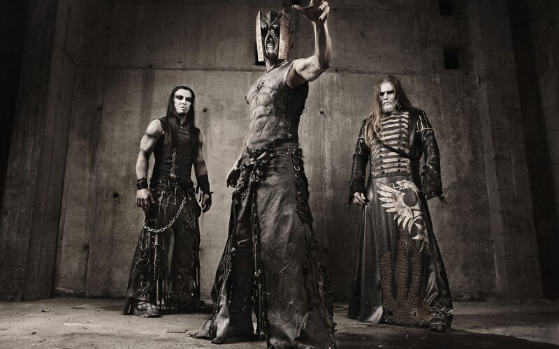 metal band in dark costumes