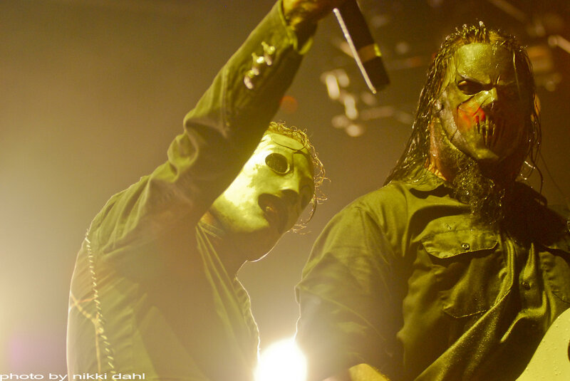 Metal band on stage with masks