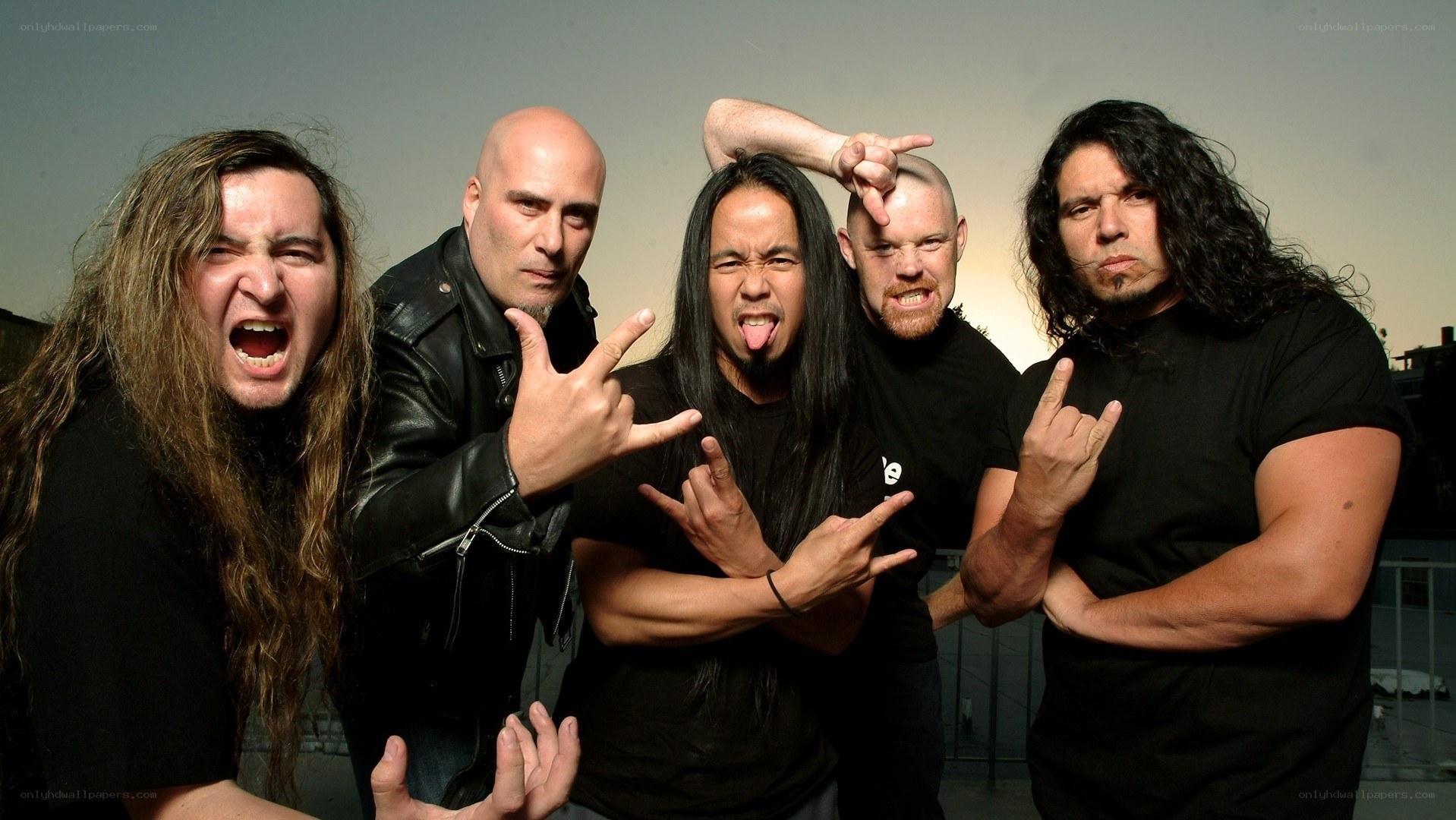 metal band posing on rooftop