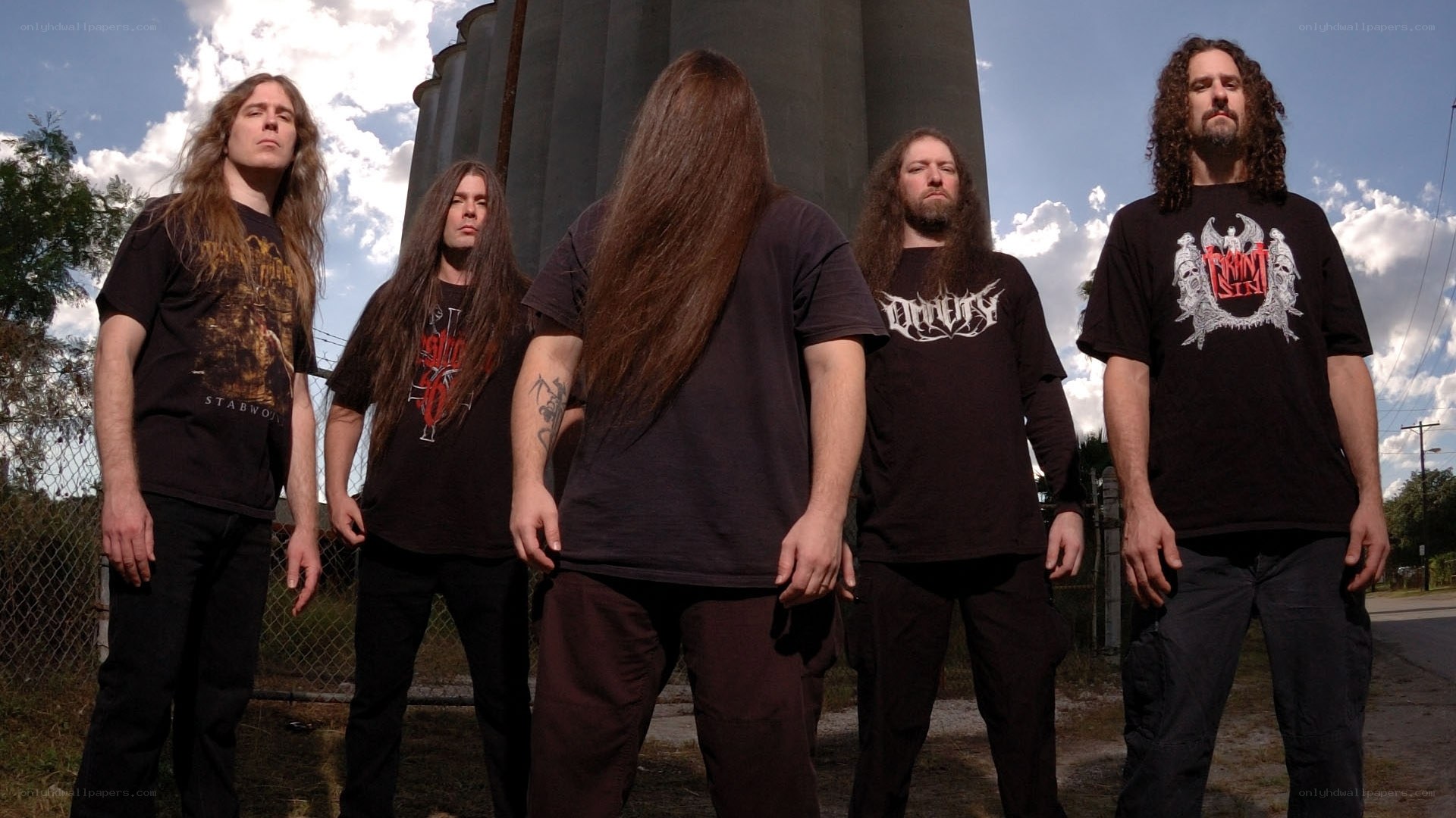 metal band posing outdoors