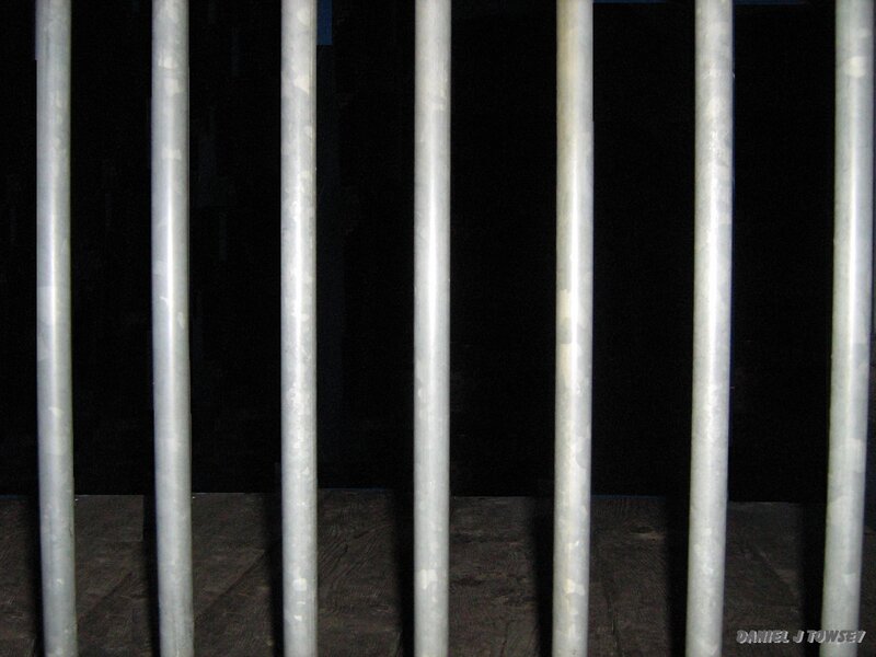metal bars in a dark room