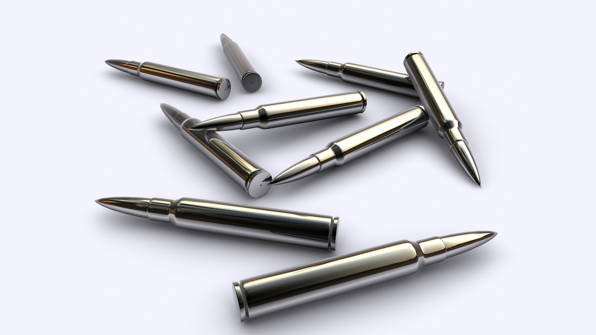 Metal bullets on white surface