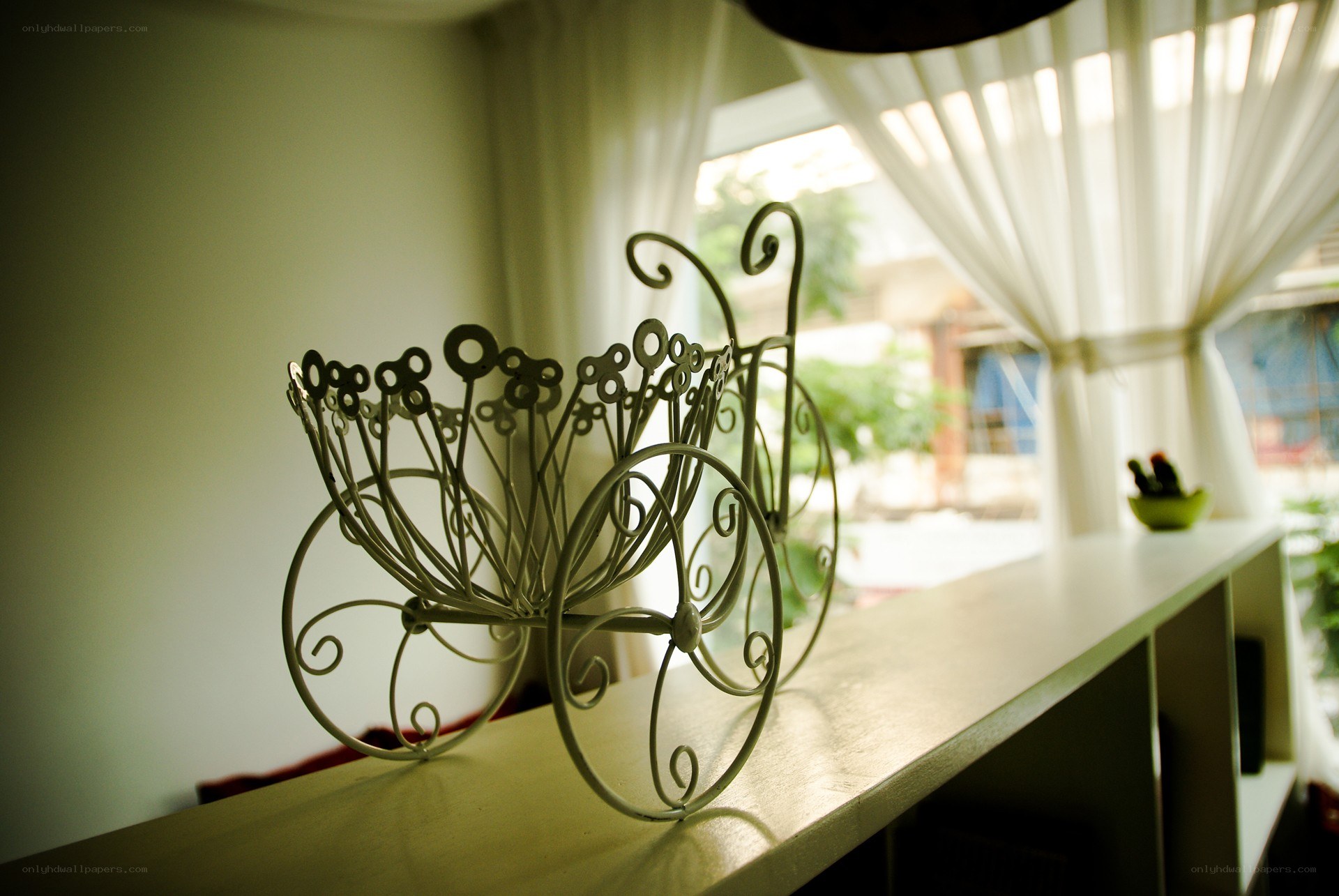 Metal carriage decor by window