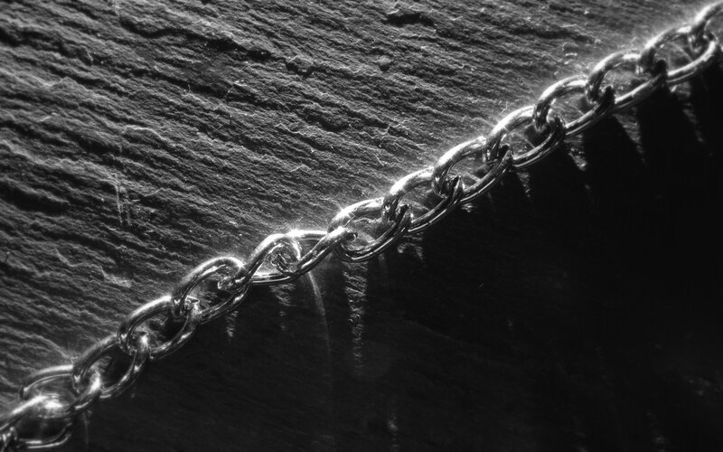 metal chain on stone surface