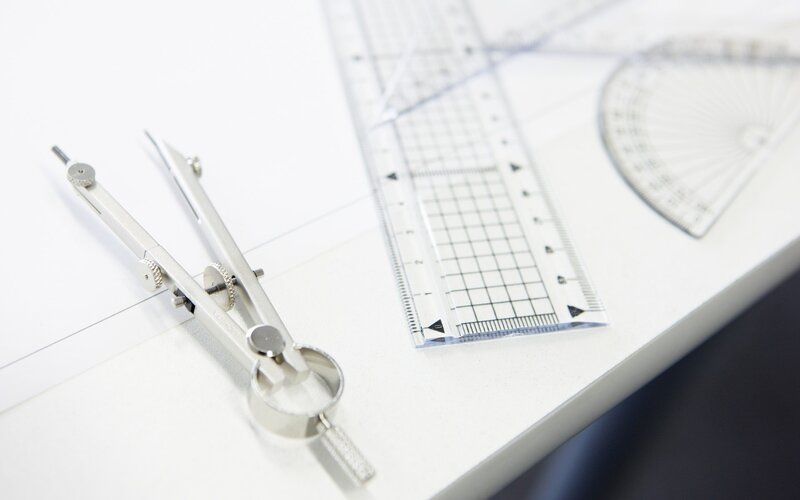 Metal Compass on Paper