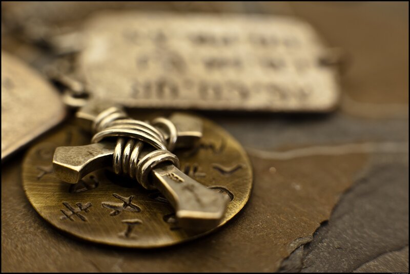 metal cross pendant with inscriptions