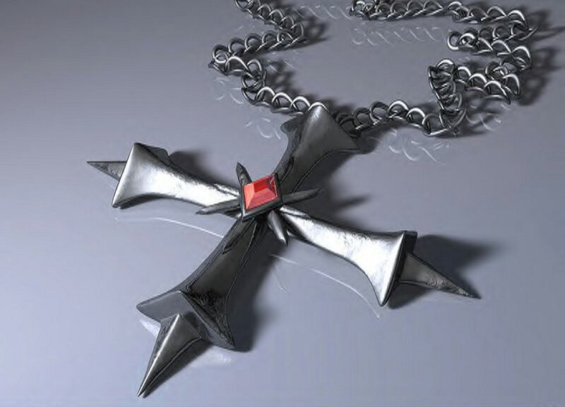 metal cross pendant with red gem