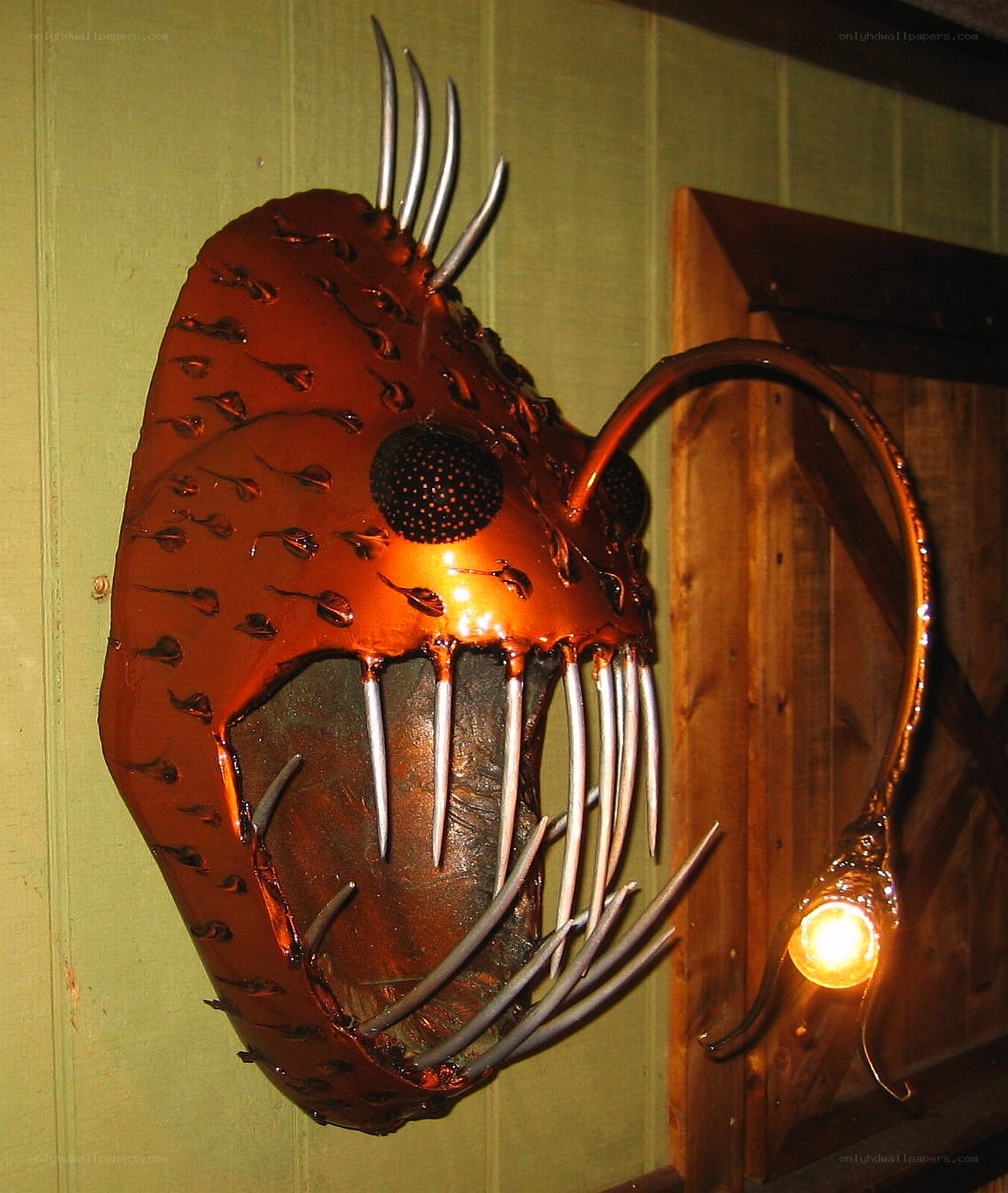 metal fish sculpture with light