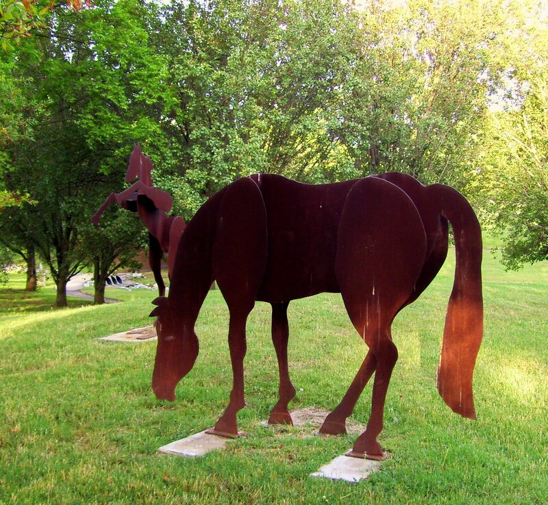 Metal horse sculpture in park