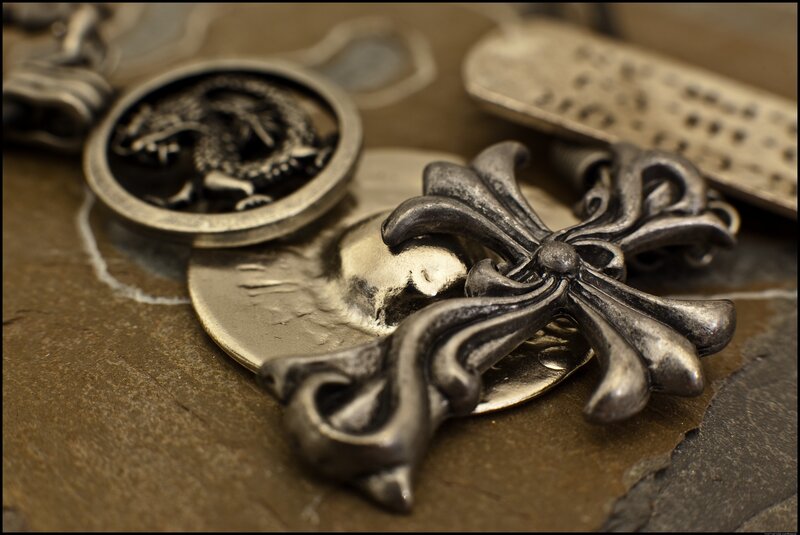 metal jewelry with dragon and cross