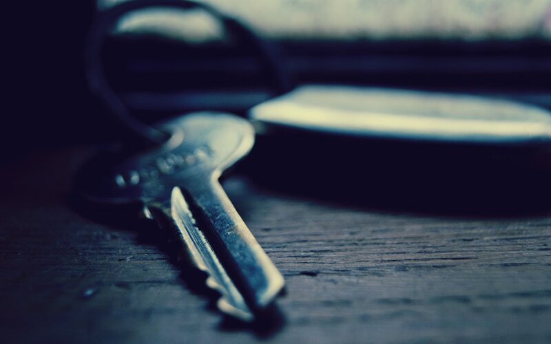 Metal Key on Wood
