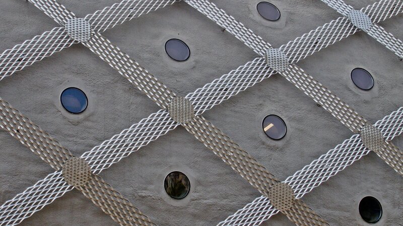 metal mesh on concrete wall
