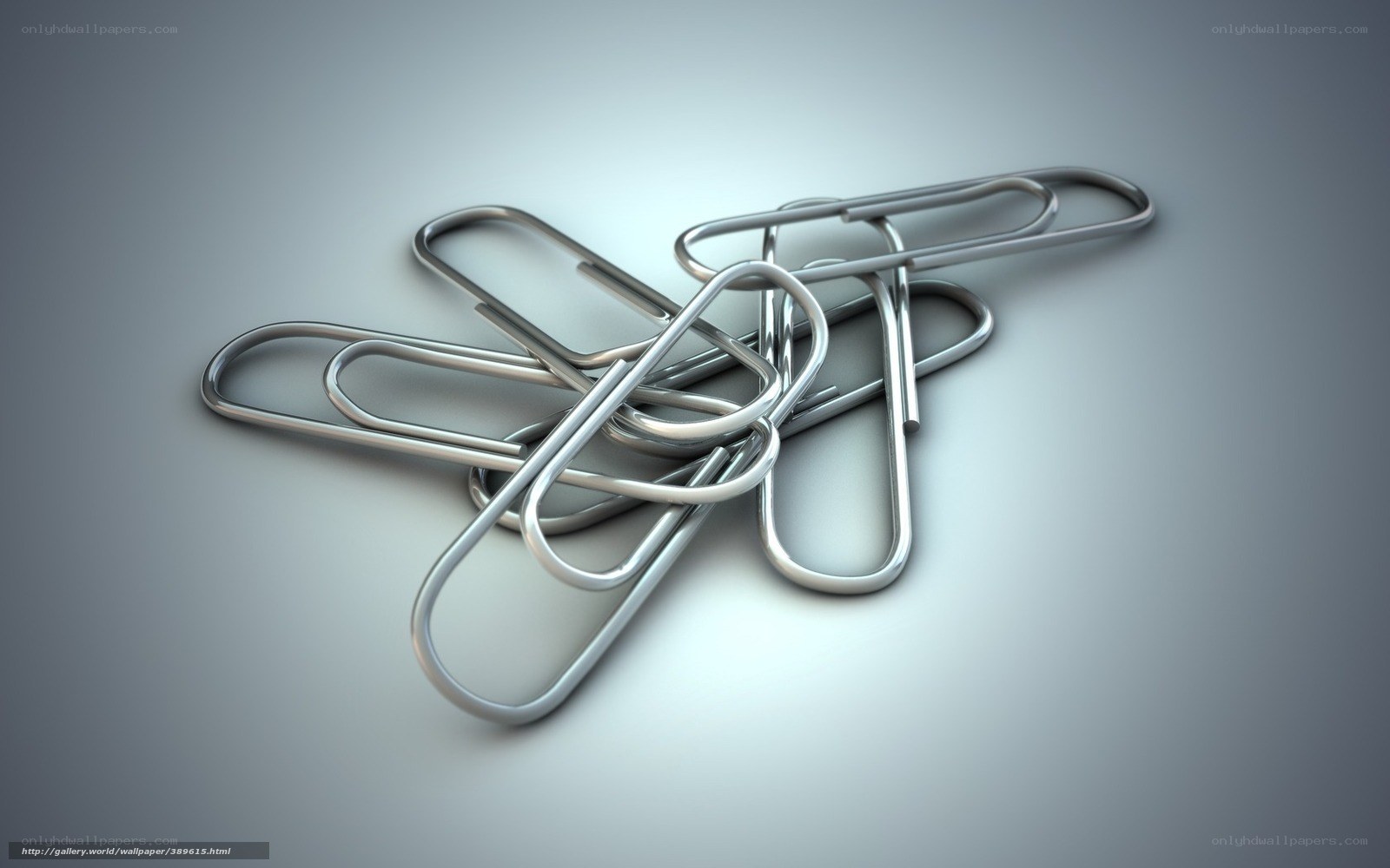 Metal paper clips on gray surface