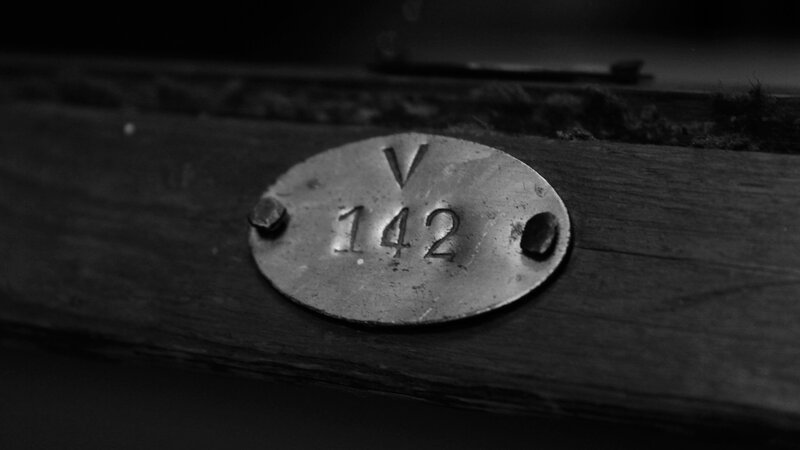 metal plaque with number 142