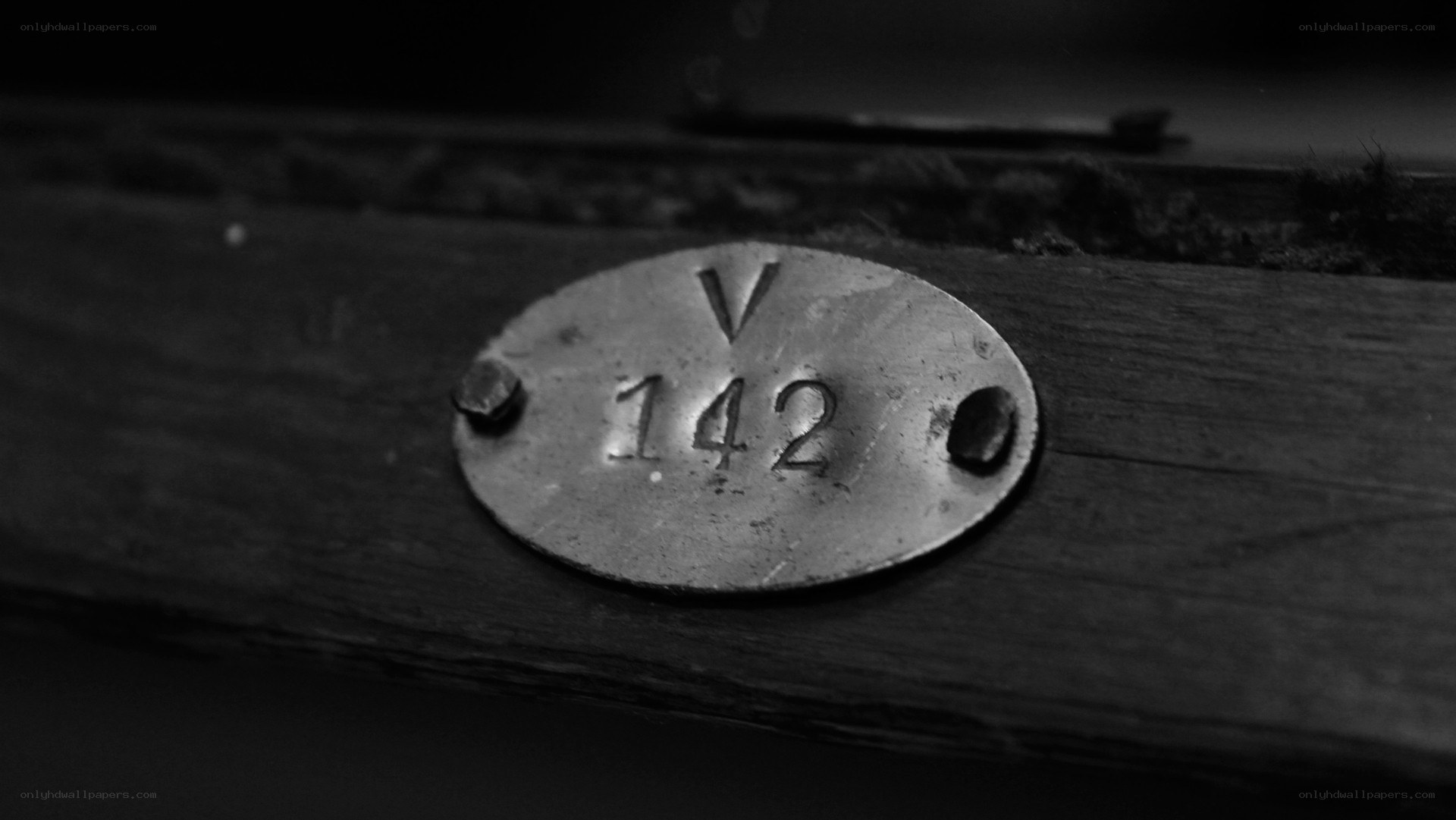 metal plaque with number 142
