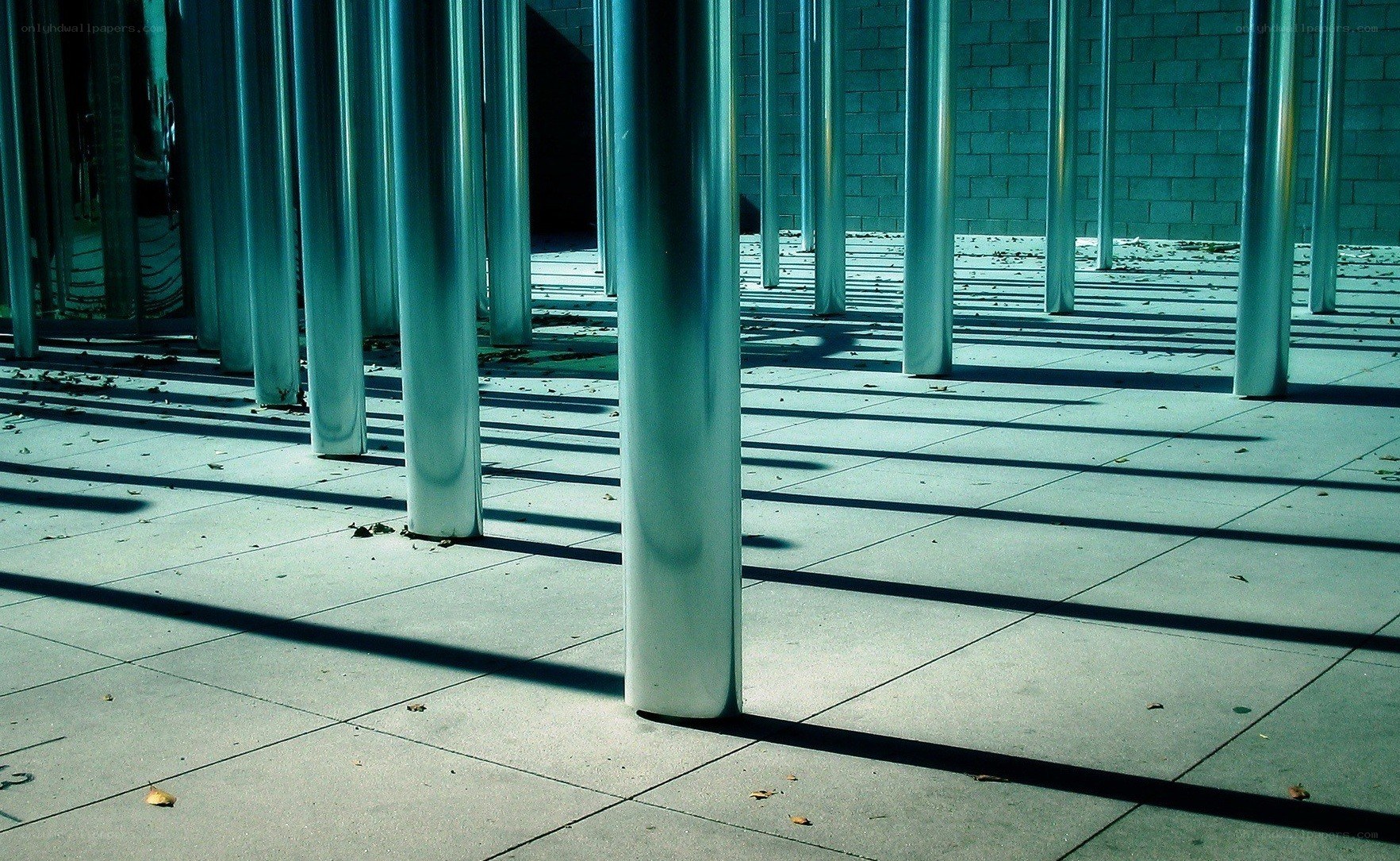 Metal poles casting shadows