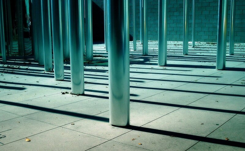 Metal Poles Casting Shadows — Gray, Dramatic, Afternoon