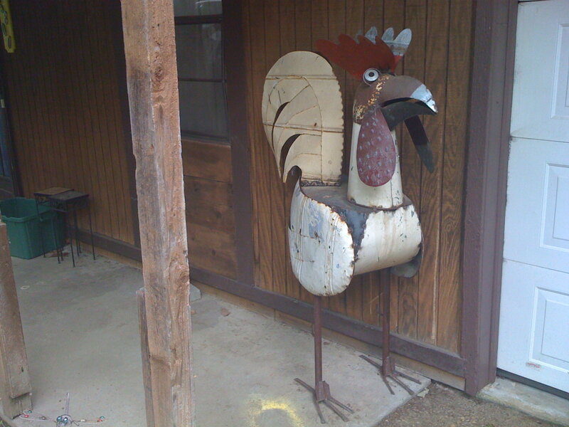 Metal rooster sculpture outside