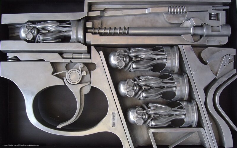 Metal sculpture of gun with alien figures