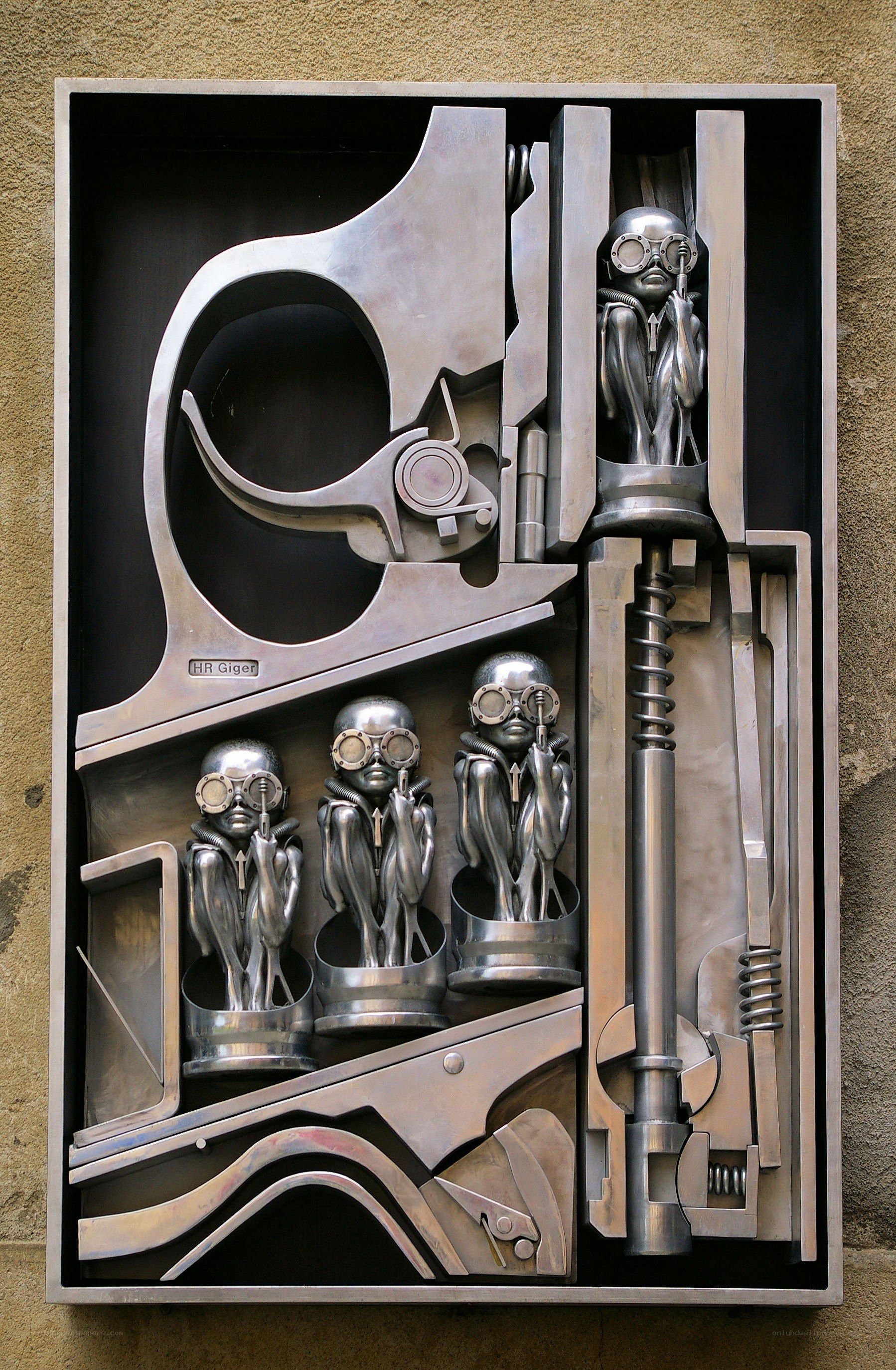 metal sculpture with alien figures