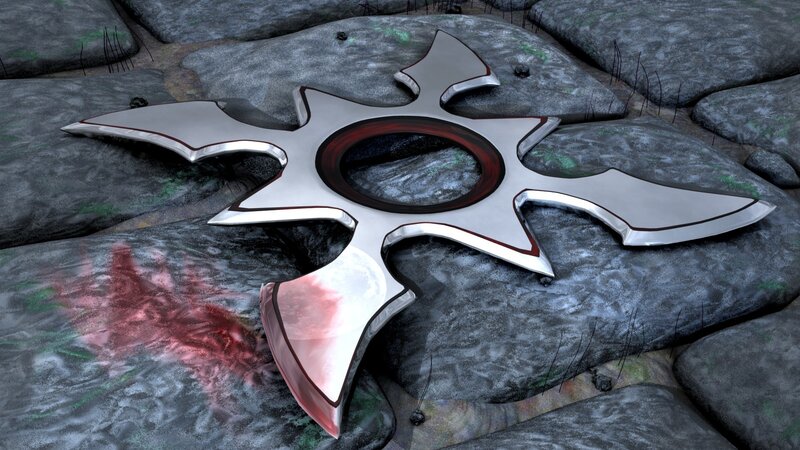 Metal shuriken on rocky ground