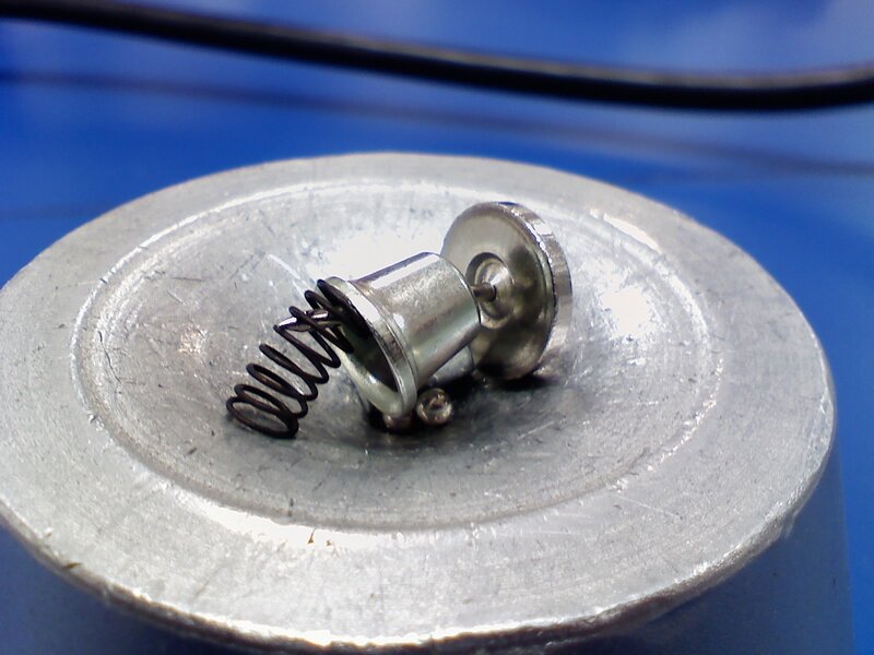 metal spring mechanism on metal disc